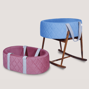 Pink and blue baby bouncers on a light gray
