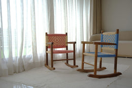 Two wooden rocking chairs