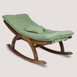Wooden rocking chair with green cushion 