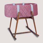 Pink quilted baby bassinet 