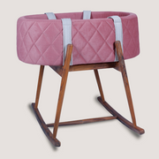 Pink quilted baby bassinet 